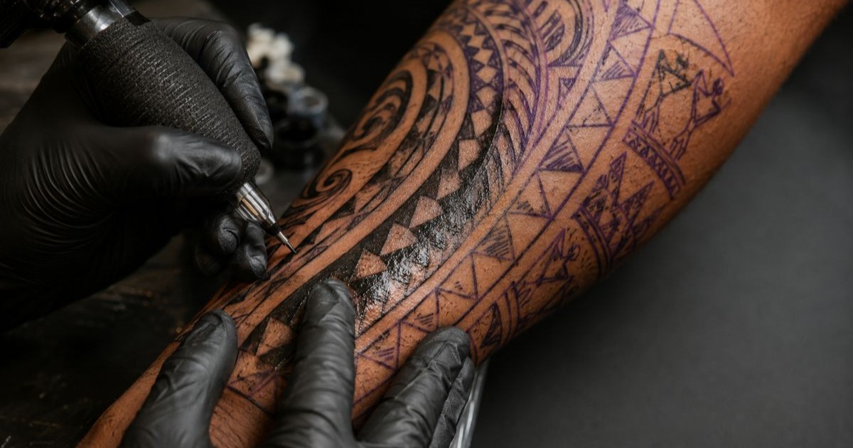 Detailed Polynesian-style tribal sleeve in progress at Glamour Tattoo Studio, Grand Baie, Mauritius